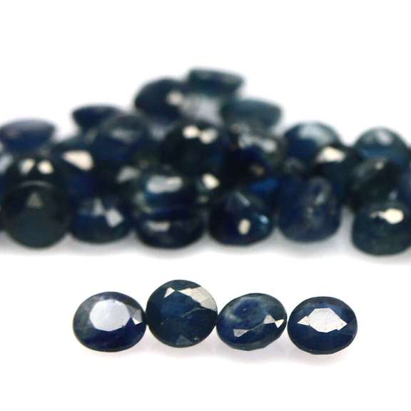 Heated only! 9.37ct deep blue sapphire set