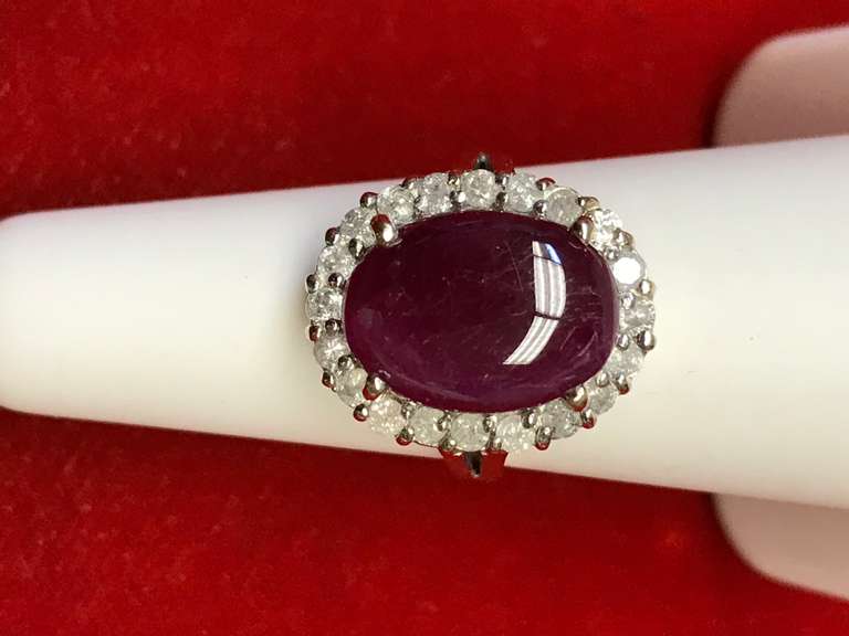 14K GOLD LADIES DIAMOND AND RUBY RING.