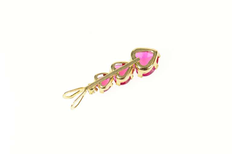 10K Yellow Gold Tiered Syn. Ruby Heart CZ Journey Symbol Pendant