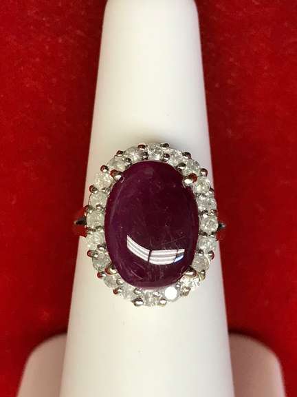 14K GOLD LADIES DIAMOND AND RUBY RING.