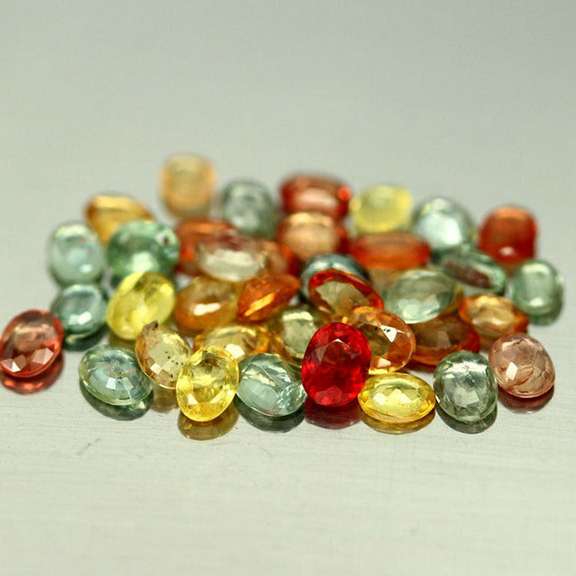 Heated only! Vibrant 6.92ct fancy color Sapphire set