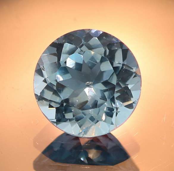 Glittering 4.47ct 10mm sky blue Topaz solitaire