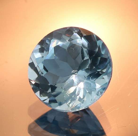Glittering 4.47ct 10mm sky blue Topaz solitaire