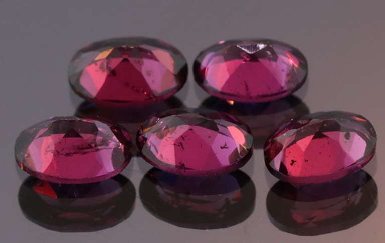 Amazing 8.74ct oval cut violet Garnet set