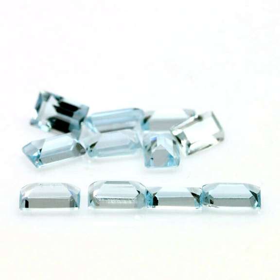 Vivid! 4.16ct emerald cut Swiss blue Topaz set
