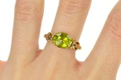 10K Yellow Gold Faceted Oval Peridot Scroll Filigree Ring