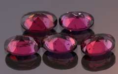 Amazing 8.74ct oval cut violet Garnet set