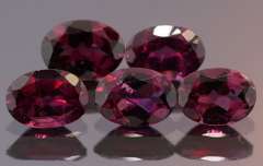 Amazing 8.74ct oval cut violet Garnet set