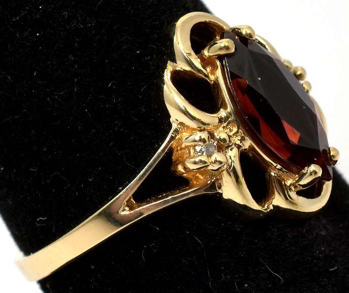 Filigree Garnet Ring with Diamond Accents in Yellow Gold