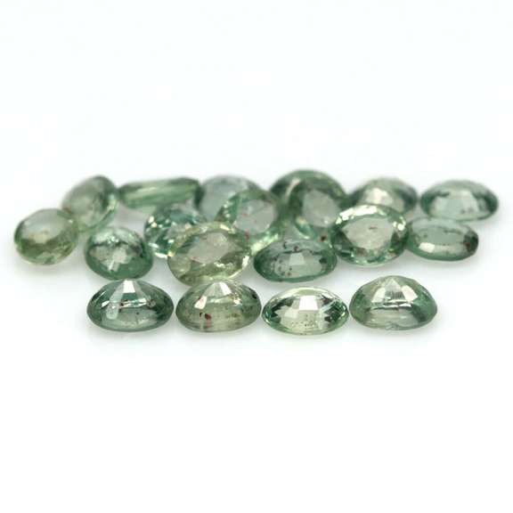 Heated only! 8.13ct oval cut green Sapphire set