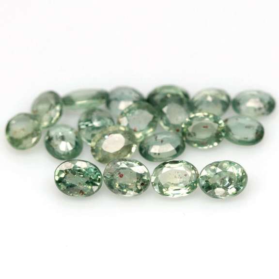 Heated only! 8.13ct oval cut green Sapphire set