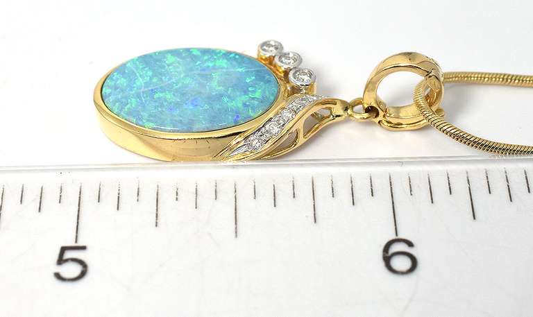 Enchanting Opal Pendant with Diamonds in 14 KT Yellow Gold