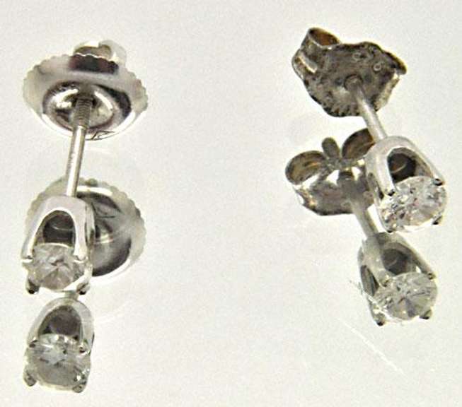 LADIES 14 KT WHITE GOLD DIAMOND STUDS.