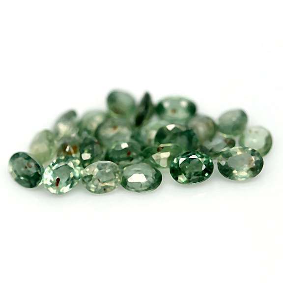 Heated only! 10.11ct oval cut green Sapphire set