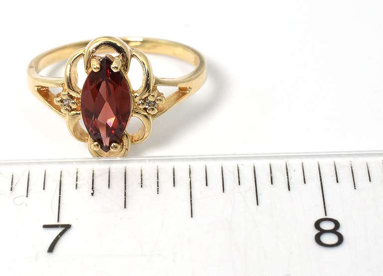 Filigree Garnet Ring with Diamond Accents in Yellow Gold