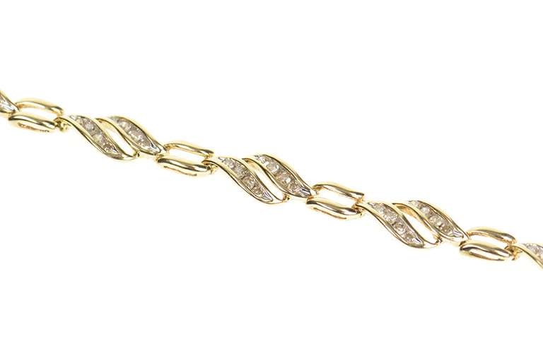 10K Yellow Gold 1.44 Ctw Diamond Wavy Channel Tennis Bracelet