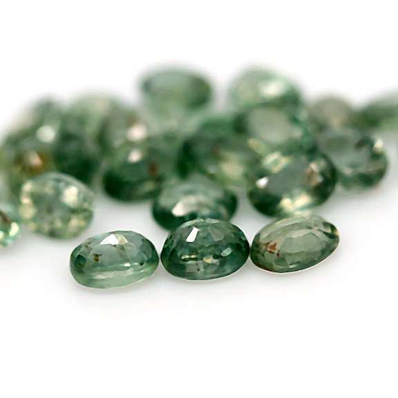 Heated only! 10.11ct oval cut green Sapphire set