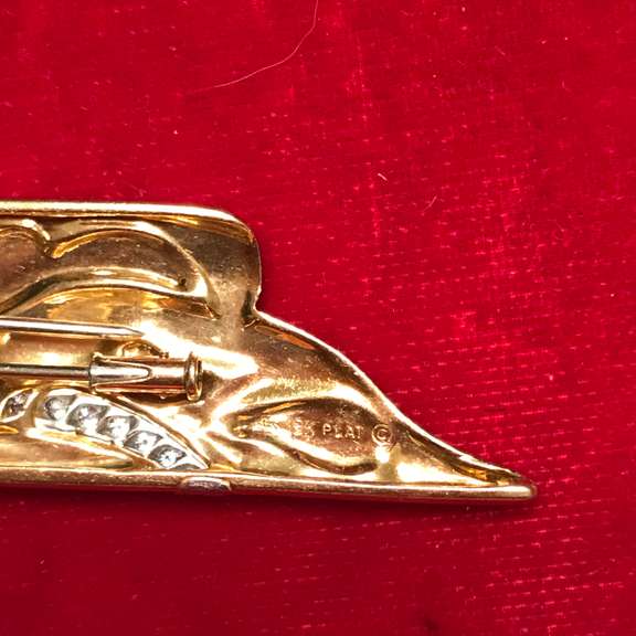 18k gold and platinum , diamond and onyx brooch