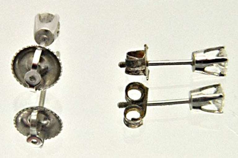LADIES 14 KT WHITE GOLD DIAMOND STUDS.