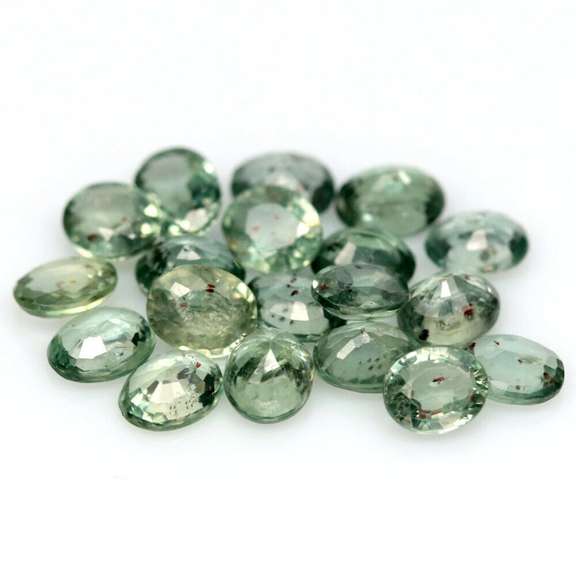 Heated only! 8.13ct oval cut green Sapphire set