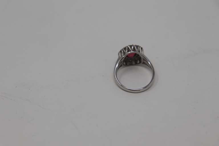 Tasteful White Gold Salmon Spinel & Diamond Halo Ring