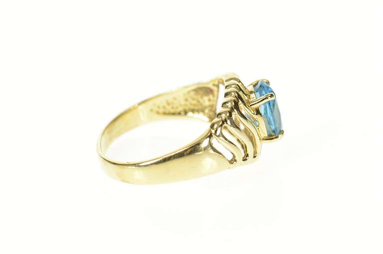 14K Yellow Gold Oval Blue Topaz Wavy Pattern Statement Ring