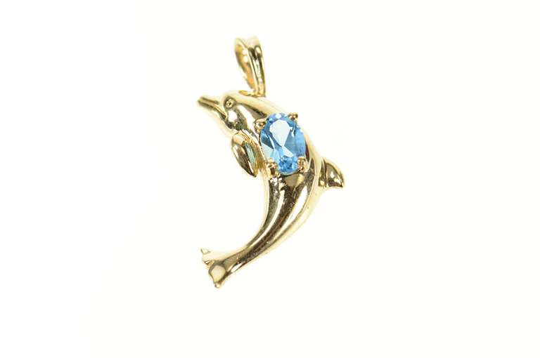 10K Yellow Gold Oval Blue Topaz Jumping Dolphin Pendant