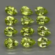 Fantastic 5.39ct 6x4mm round cut Peridot set