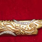 18k gold and platinum , diamond and onyx brooch