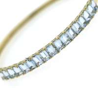 Glamorous 14kt Yellow Gold Hinged Blue Topaz Bangle Bracelet