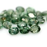 Heated only! 10.11ct oval cut green Sapphire set