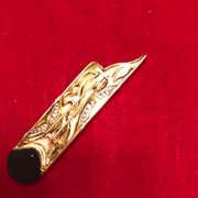 18k gold and platinum , diamond and onyx brooch