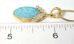 Enchanting Opal Pendant with Diamonds in 14 KT Yellow Gold