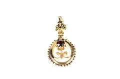 14K Yellow Gold Ornate Garnet Inset Floral Motif Oval Pendant