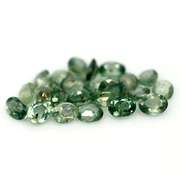 Heated only! 10.11ct oval cut green Sapphire set