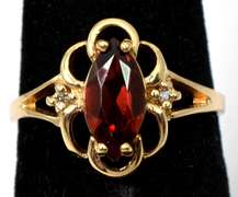 Filigree Garnet Ring with Diamond Accents in Yellow Gold