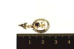14K Yellow Gold Ornate Garnet Inset Floral Motif Oval Pendant