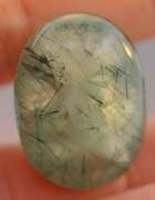 Magnificent 50.49ct deep green rutilated Prehnite cabochon