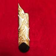 18k gold and platinum , diamond and onyx brooch