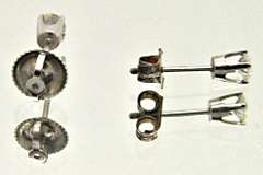 LADIES 14 KT WHITE GOLD DIAMOND STUDS.