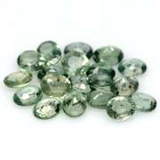 Heated only! 8.13ct oval cut green Sapphire set