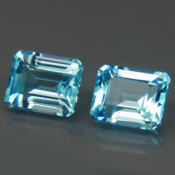 VS clarity 8.09ct vivid blue emerald cut Topaz set