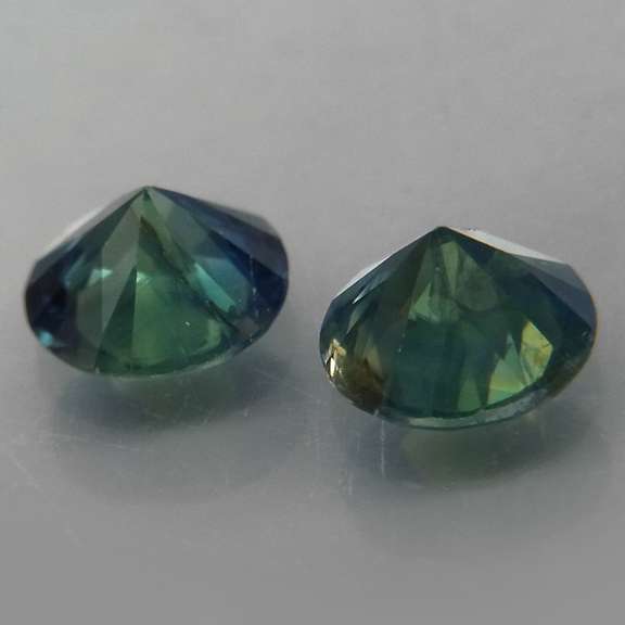 Unheated! .98ct diamond cut blue green Sapphire set