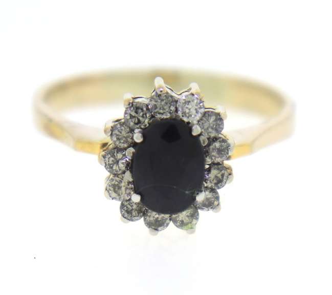 Stylish Yellow Gold Oval Sapphire & Round Diamond Halo Ring