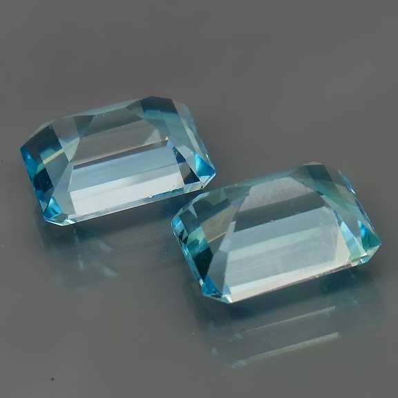 Eye clean 6.13ct vivid blue emerald cut Topaz set