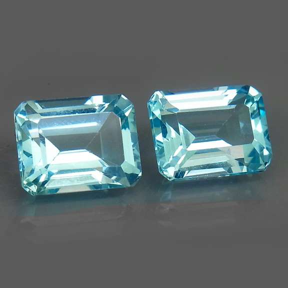 Eye clean 6.13ct vivid blue emerald cut Topaz set