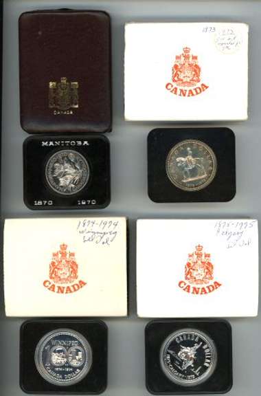 4 diff. Canadian Silver Dollars. Original boxes 1970-75