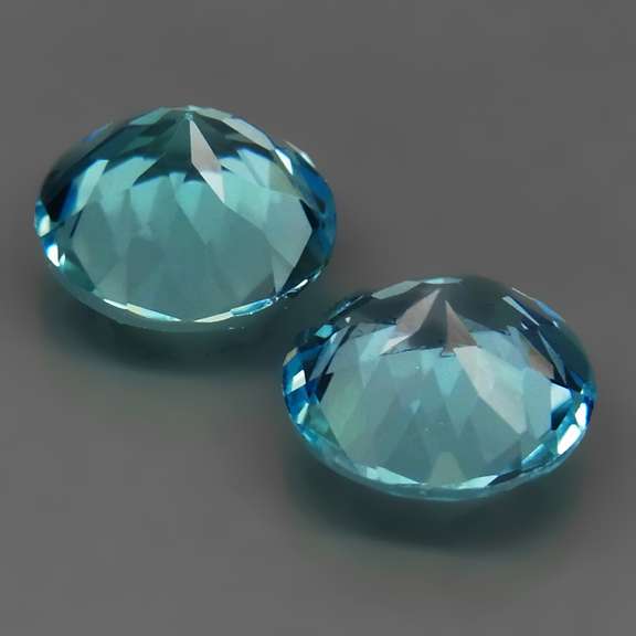 Eye clean 7.02ct round brilliant cut Topaz pair