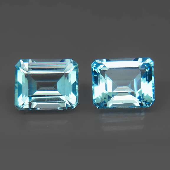 VS clarity 8.09ct vivid blue emerald cut Topaz set