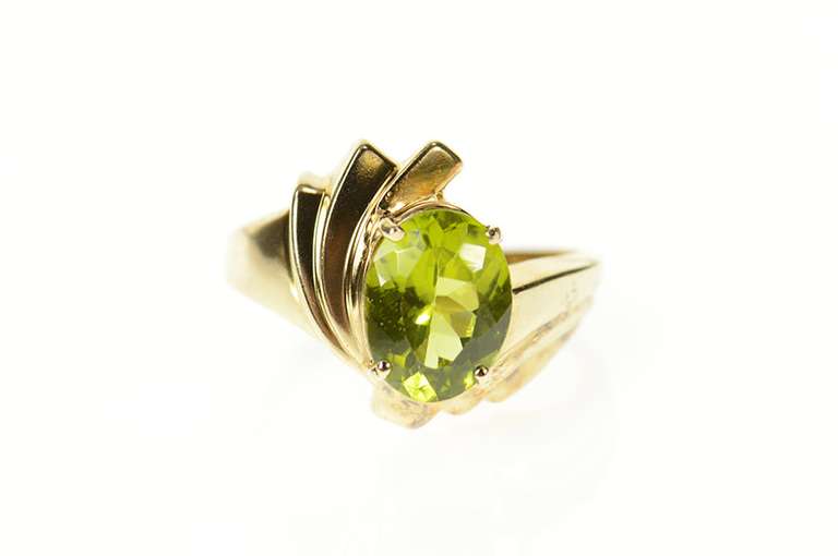 10K Yellow Gold Wavy Curvy Grooved Bypass Oval Peridot Ring